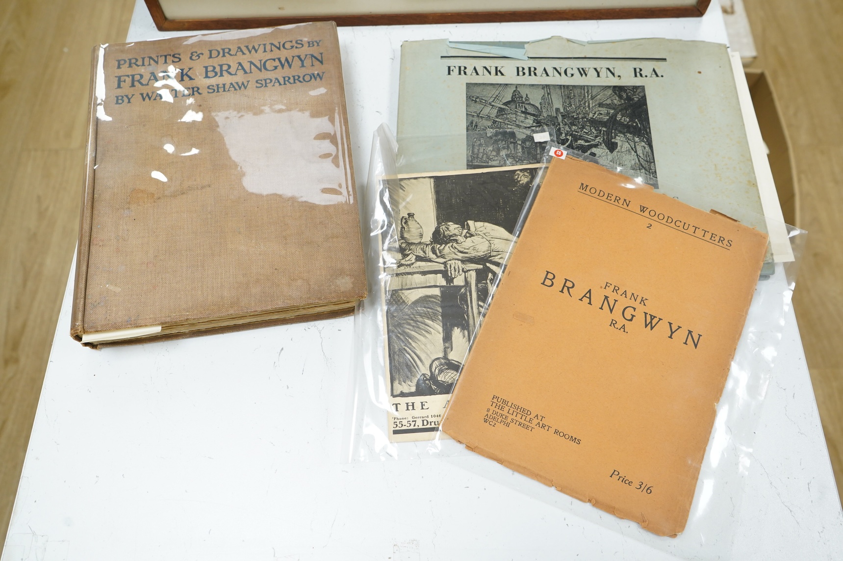 Frank Brangwyn RA RWS RBA (Welsh, 1867-1956), ‘Breaking up the Caledonia’, signed in pencil, lithograph, 28 x 37cm, together with a hardback book, Masters of Etching No.1 Frank Brangwyn and two modern woodcutters booklet